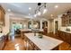 Bright kitchen with marble countertops, hardwood floors, and an open layout to dining area at 5284 Vernon Springs Nw Trl, Sandy Springs, GA 30327