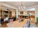 Open living and dining area with a stone fireplace and views to the kitchen at 5284 Vernon Springs Nw Trl, Sandy Springs, GA 30327
