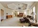A spacious main bedroom features a unique wood bed frame and a sitting area with leather chairs and an ottoman at 5284 Vernon Springs Nw Trl, Sandy Springs, GA 30327