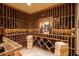 Impressive wine cellar with extensive wooden racking and a cozy tasting area at 5284 Vernon Springs Nw Trl, Sandy Springs, GA 30327