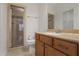 Bathroom with a glass-enclosed shower, stylish vanity, and neutral color scheme at 6054 Brookhaven Cir, Duluth, GA 30097
