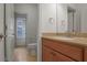 Functional bathroom featuring a vanity with built-in cabinet, soft lighting, and tile floors at 6054 Brookhaven Cir, Duluth, GA 30097
