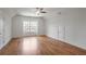 Spacious bonus room featuring a large window and gleaming hardwood floors for versatile use at 6054 Brookhaven Cir, Duluth, GA 30097