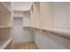 Spacious walk-in closet with custom shelving and ample storage space for an organized wardrobe at 6054 Brookhaven Cir, Duluth, GA 30097