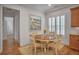 Charming dining area with a wood table, natural light and decorative painting at 6054 Brookhaven Cir, Duluth, GA 30097