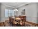 Charming dining room with elegant chandelier, ample seating, and a beautiful rug at 6054 Brookhaven Cir, Duluth, GA 30097