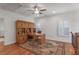 Well-lit office space with custom built-ins, a beautiful rug, and shuttered windows at 6054 Brookhaven Cir, Duluth, GA 30097
