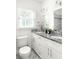 Bright bathroom with dual sinks, granite countertop and stand-up shower at 1170 Westmont Sw Rd, Atlanta, GA 30311