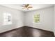 Sunlit bedroom with hardwood floors, white walls, and large windows at 1170 Westmont Sw Rd, Atlanta, GA 30311