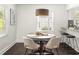 Dining area with a modern light fixture and kitchen bar seating visible at 1170 Westmont Sw Rd, Atlanta, GA 30311