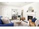 Bright living room featuring a fireplace, hardwood floors, and an open layout at 1170 Westmont Sw Rd, Atlanta, GA 30311