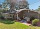 A cozy outdoor seating area on a brick patio, perfect for entertaining or relaxing in a serene backyard setting at 2655 Nesbit Trl, Alpharetta, GA 30022
