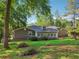 Charming home with a lush green backyard surrounded by mature trees, offering a private retreat at 2655 Nesbit Trl, Alpharetta, GA 30022