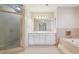 The primary bathroom boasts a dual sink vanity, and separate tub and shower at 2655 Nesbit Trl, Alpharetta, GA 30022