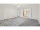 Bright bedroom features neutral carpet, ceiling fan, and access to the bathroom at 2655 Nesbit Trl, Alpharetta, GA 30022