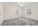 Cozy bedroom features neutral carpet, white trim, and bright windows at 2655 Nesbit Trl, Alpharetta, GA 30022