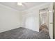 Well-lit bedroom features neutral carpet, ceiling fan, and a spacious closet at 2655 Nesbit Trl, Alpharetta, GA 30022