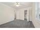 Bedroom featuring neutral carpet, ceiling fan, and a spacious closet at 2655 Nesbit Trl, Alpharetta, GA 30022