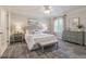 Comfortable bedroom with carpet flooring, a full bed, and tasteful decor at 2655 Nesbit Trl, Alpharetta, GA 30022