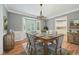 Elegant dining room with natural light, a decorative chandelier and neutral gray paint at 2655 Nesbit Trl, Alpharetta, GA 30022