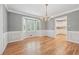 Elegant dining room with large bay window, decorative chandelier and hardwood floors at 2655 Nesbit Trl, Alpharetta, GA 30022