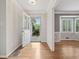 Light-filled entryway with hardwood floors, and open sightlines to other rooms at 2655 Nesbit Trl, Alpharetta, GA 30022