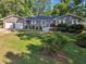 Two car garage, gray siding, and a well-manicured lawn enhance this lovely home's curb appeal at 2655 Nesbit Trl, Alpharetta, GA 30022