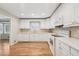 Bright kitchen with white cabinets, modern appliances, and hardwood floors at 2655 Nesbit Trl, Alpharetta, GA 30022