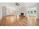Spacious living room with hardwood floors and fireplace, perfect for entertaining at 2655 Nesbit Trl, Alpharetta, GA 30022