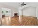 Vaulted ceiling living room with a brick fireplace, hardwood flooring and plenty of natural light at 2655 Nesbit Trl, Alpharetta, GA 30022