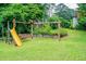 A spacious backyard contains a playset including swings, a slide, and bench seating at 3854 Ridgewood Se Dr, Smyrna, GA 30080