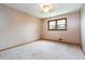 This bedroom is bright with natural lighting from the window and has a ceiling fan at 3854 Ridgewood Se Dr, Smyrna, GA 30080