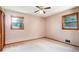 This bedroom is bright with natural lighting from the two windows and a ceiling fan at 3854 Ridgewood Se Dr, Smyrna, GA 30080