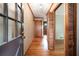 Inviting hallway featuring hardwood floors, decorative molding, and a glimpse into adjoining rooms at 3854 Ridgewood Se Dr, Smyrna, GA 30080