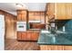 Kitchen with wood cabinets, laminate countertops, and views to an eat-in area at 3854 Ridgewood Se Dr, Smyrna, GA 30080