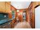 View of a kitchen area with wood-paneled walls and cabinets at 3854 Ridgewood Se Dr, Smyrna, GA 30080