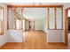 Open-concept living room with hardwood floors and decorative wood columns and beams at 3854 Ridgewood Se Dr, Smyrna, GA 30080