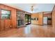 Comfortable living room featuring a brick fireplace, wood paneling, and built-in features at 3854 Ridgewood Se Dr, Smyrna, GA 30080