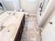 Bathroom featuring a double vanity, neutral colors, and great lighting at 4220 Sawgrass Dr, Lithonia, GA 30038