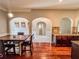 Dining room with wood floors and open layout to the kitchen at 4220 Sawgrass Dr, Lithonia, GA 30038