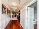 Spacious hallway with hardwood floors, molding, and access to bathroom at 4220 Sawgrass Dr, Lithonia, GA 30038