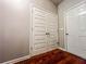 Hallway featuring hardwood floors, closet, and white doors at 4220 Sawgrass Dr, Lithonia, GA 30038