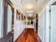 Elegant hallway with hardwood floors, crown molding, and decorative artwork at 4220 Sawgrass Dr, Lithonia, GA 30038