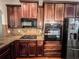 Kitchen with stainless steel appliances, gas stove, and granite countertops at 4220 Sawgrass Dr, Lithonia, GA 30038