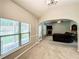 Living room featuring a fireplace and backyard view at 4220 Sawgrass Dr, Lithonia, GA 30038
