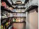 Walk-in pantry with lots of shelves for storage and organization at 4220 Sawgrass Dr, Lithonia, GA 30038