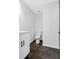 Small and modern bathroom with a white vanity, toilet, and dark tile flooring at 4800 Countryside E, Stone Mountain, GA 30083