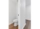 A half bathroom featuring a modern toilet and hardwood flooring at 4800 Countryside E, Stone Mountain, GA 30083