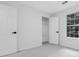 Well lit bedroom featuring 2 closets, neutral carpeting, and a window at 4800 Countryside E, Stone Mountain, GA 30083