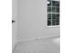 Bedroom featuring neutral carpeting, light walls and trim with a window at 4800 Countryside E, Stone Mountain, GA 30083